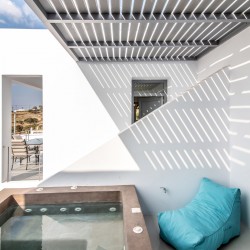 Outdoor jacuzzi with Aegean Sea views on the second terrace of Villa Aegean Colors.