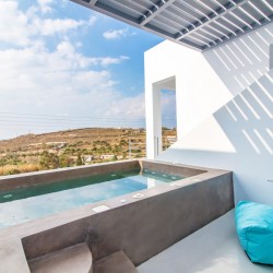 Outdoor jacuzzi with Aegean Sea views on the second terrace of Villa Aegean Colors.