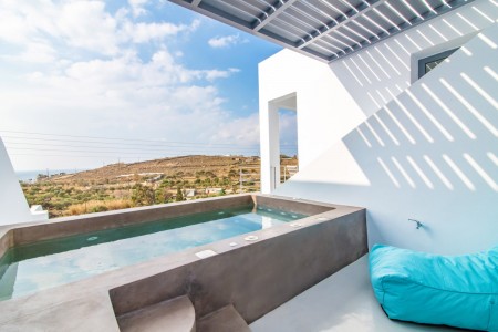 Outdoor jacuzzi with Aegean Sea views on the second terrace of Villa Aegean Colors.