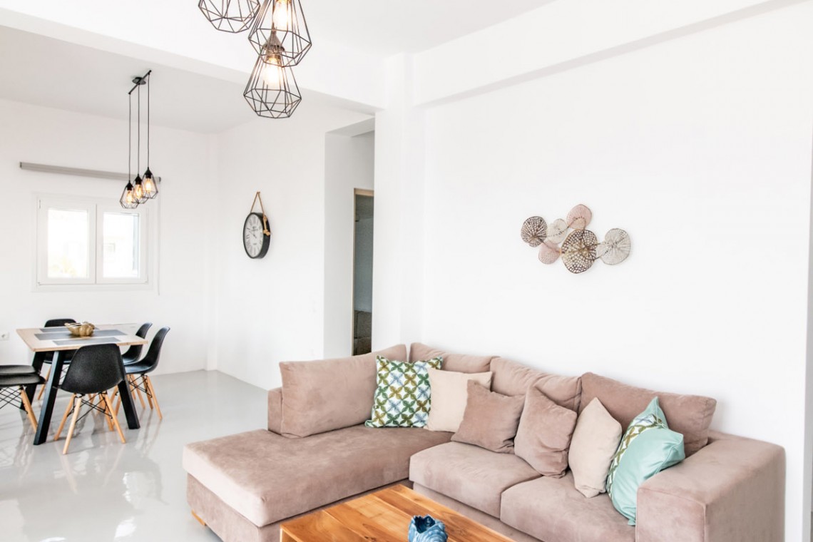 Bright and spacious living room with modern decor at Villa Aegean Colors in Tinos.