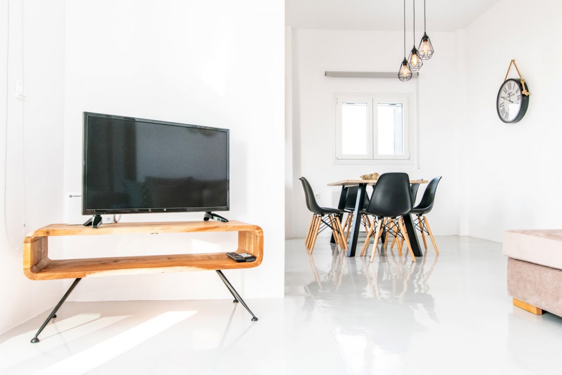 Bright and spacious living room with modern decor at Villa Aegean Colors in Tinos.