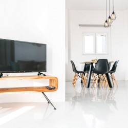 Bright and spacious living room with modern decor at Villa Aegean Colors in Tinos.