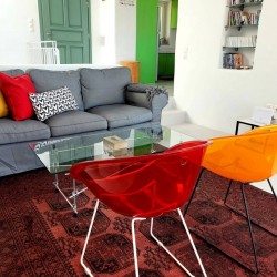Bright and spacious living room in a villa on Tinos Island, ideal for relaxation and family gatherings.