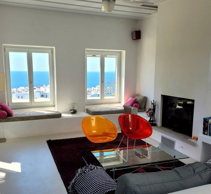 Bright and spacious living room in a villa on Tinos Island, ideal for relaxation and family gatherings.