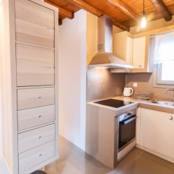 Modern kitchen and dining area in the traditional Triantaros Family House.