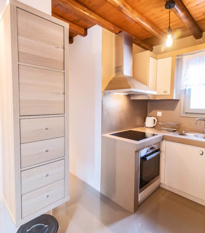 Modern kitchen and dining area in the traditional Triantaros Family House.