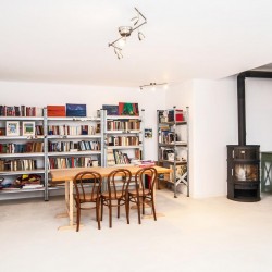 Bright and spacious living room in a villa on Tinos Island, ideal for relaxation and family gatherings.