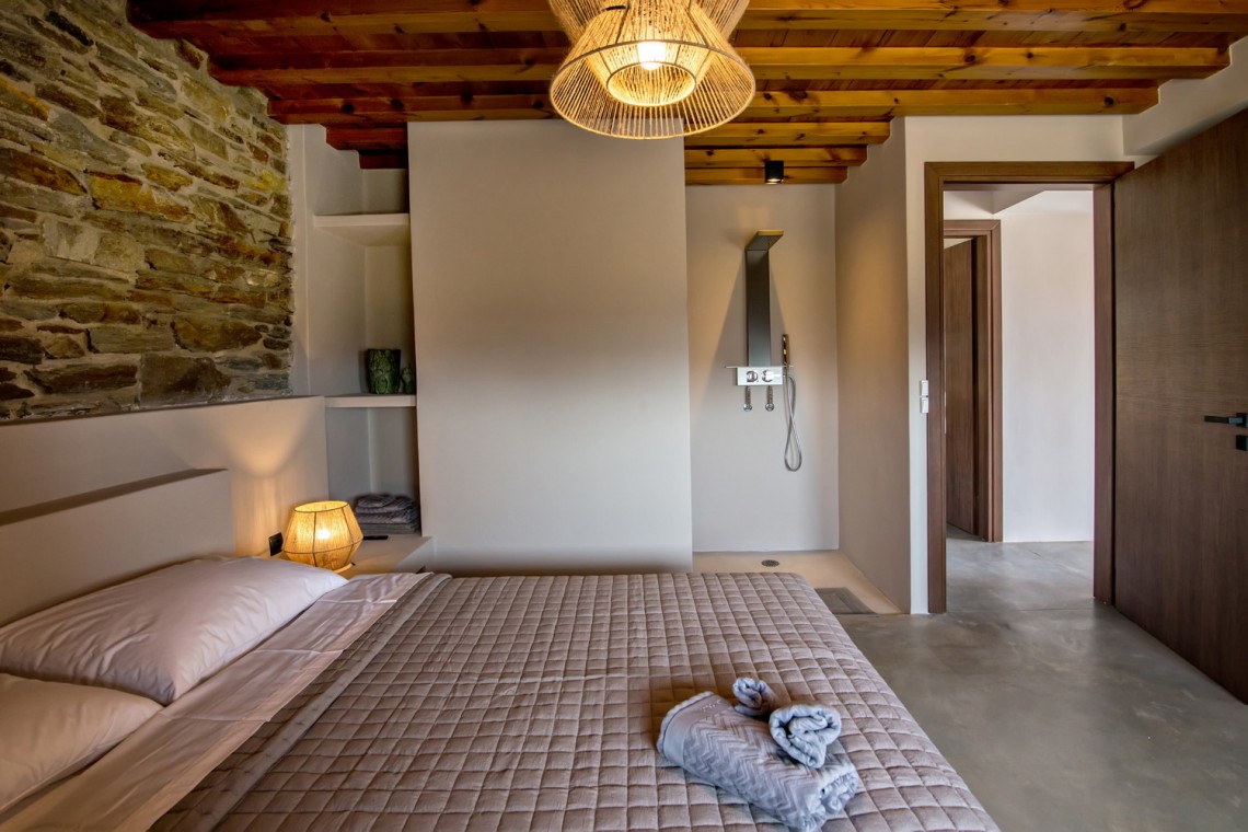Large double bedroom with ensuite walk-in shower at VF Villa in Agios Fokas, Tinos.