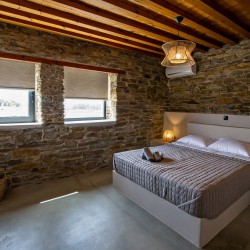 Large double bedroom with ensuite walk-in shower at VF Villa in Agios Fokas, Tinos.
