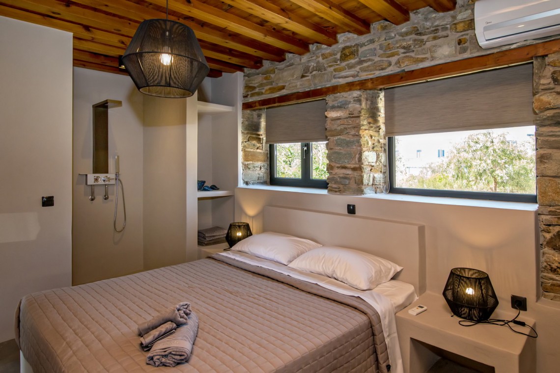 Large double bedroom with ensuite walk-in shower at VF Villa in Agios Fokas, Tinos.