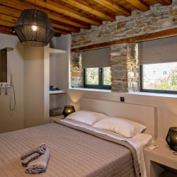 Large double bedroom with ensuite walk-in shower at VF Villa in Agios Fokas, Tinos.