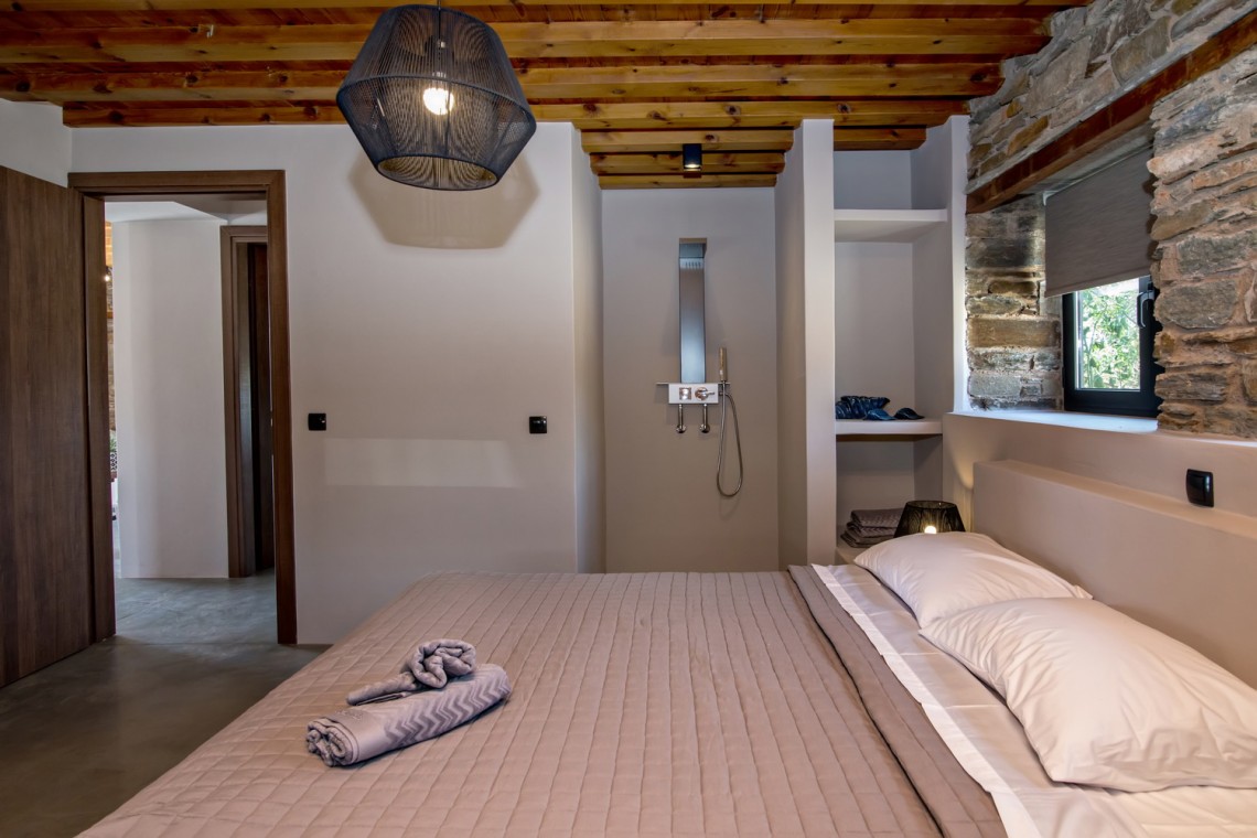 Large double bedroom with ensuite walk-in shower at VF Villa in Agios Fokas, Tinos.