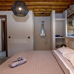 Large double bedroom with ensuite walk-in shower at VF Villa in Agios Fokas, Tinos.