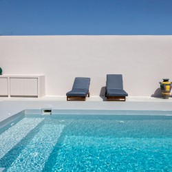 Private pool and sun loungers overlooking the rural landscape at VF Villa, Tinos.