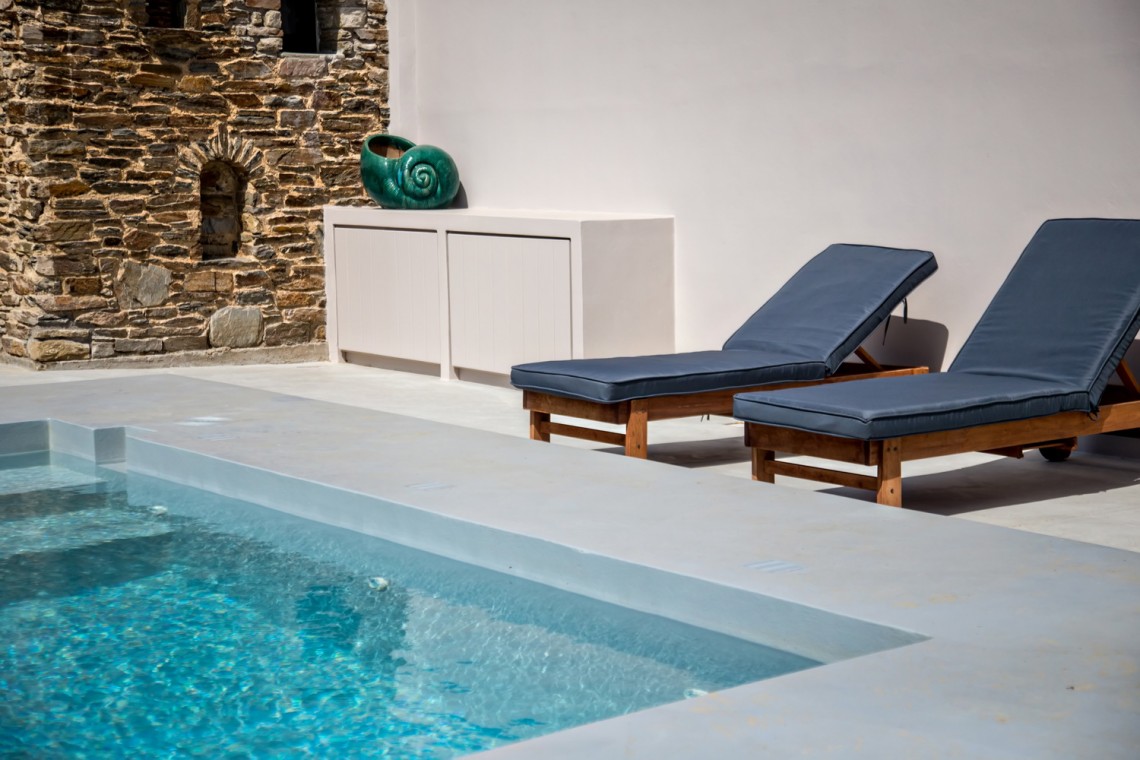 Private pool and sun loungers overlooking the rural landscape at VF Villa, Tinos.