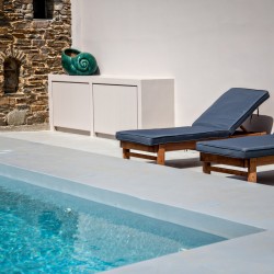 Private pool and sun loungers overlooking the rural landscape at VF Villa, Tinos.