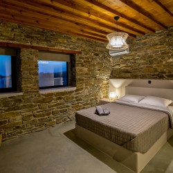 Large double bedroom with ensuite walk-in shower at VF Villa in Agios Fokas, Tinos.