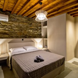 Large double bedroom with ensuite walk-in shower at VF Villa in Agios Fokas, Tinos.