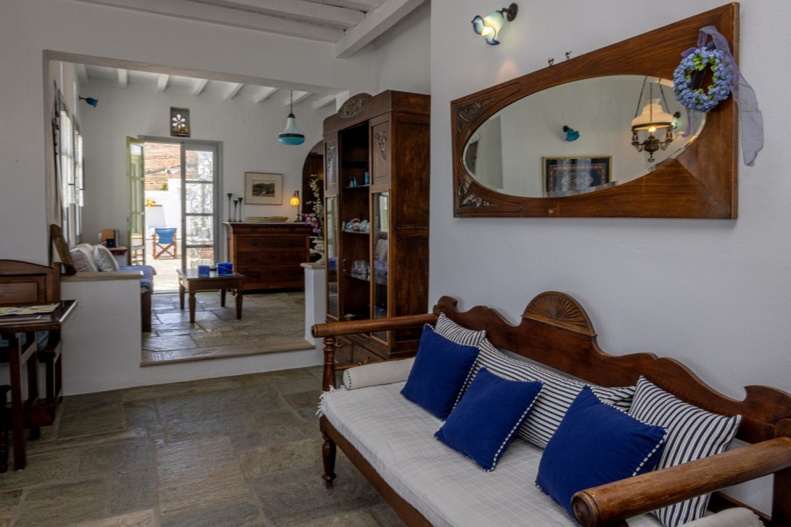 Traditional Tinian stone-built living room at Vivant Blue Mansion with Cycladic arches.