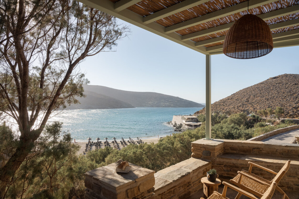 Rabela’s House exterior view at Kolibithra Beach, Tinos Island – beachfront accommodation surrounded by scenic beauty.