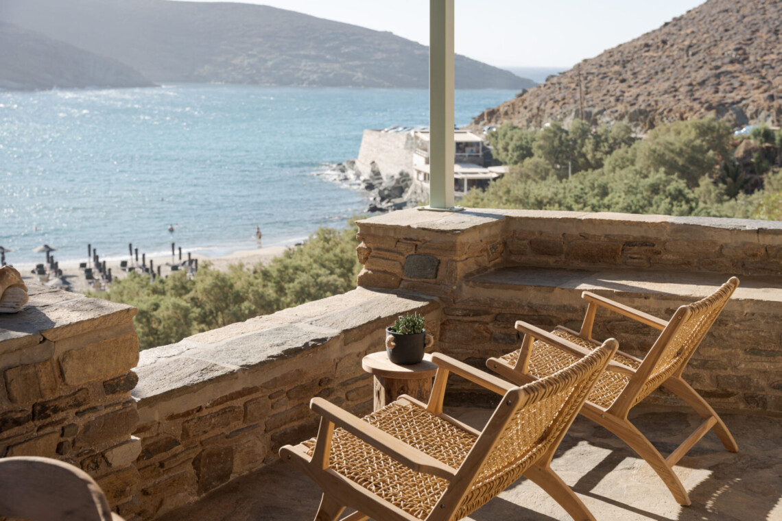 Rabela’s House exterior view at Kolibithra Beach, Tinos Island – beachfront accommodation surrounded by scenic beauty.