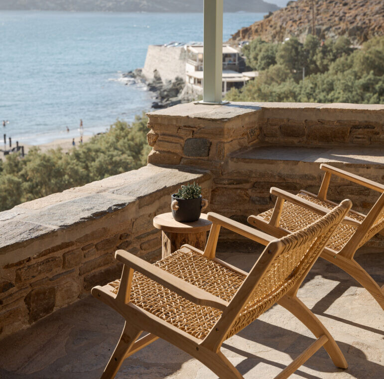 Rabela’s House exterior view at Kolibithra Beach, Tinos Island – beachfront accommodation surrounded by scenic beauty.