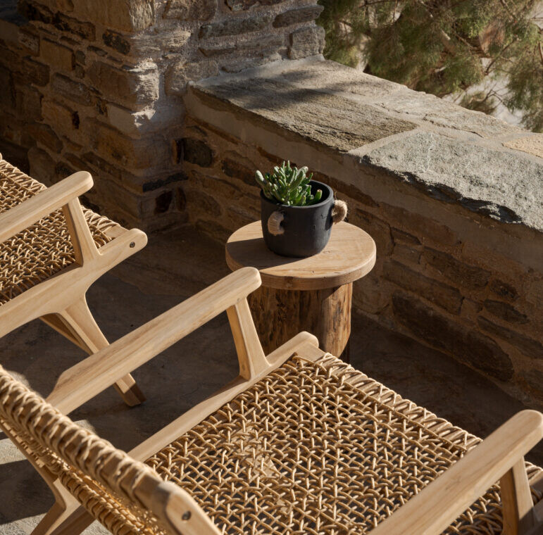 Rabela’s House exterior view at Kolibithra Beach, Tinos Island – beachfront accommodation surrounded by scenic beauty.