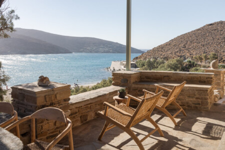 Rabela’s House exterior view at Kolibithra Beach, Tinos Island – beachfront accommodation surrounded by scenic beauty.