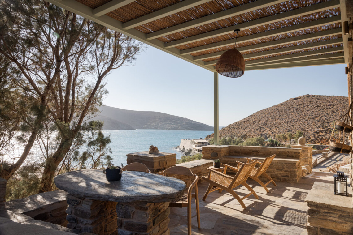 Rabela’s House exterior view at Kolibithra Beach, Tinos Island – beachfront accommodation surrounded by scenic beauty.